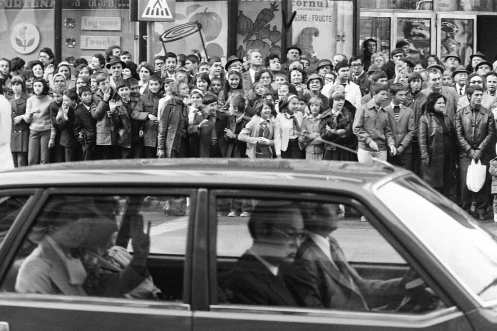 #73 Well-wishers stand outside the National Museum of Romanian History where Crown Prince Akihito and Crown Princess Michiko.
