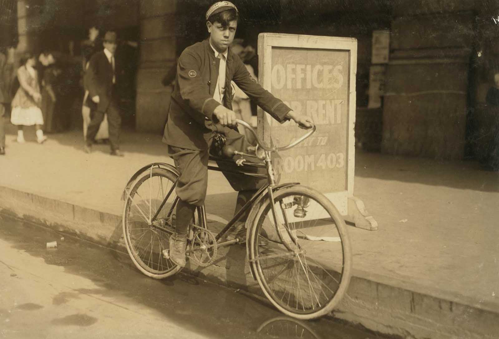 #9 A typical messenger boy in New Orleans. The telegraph companies are trying to obey the law, and few violations occur, November, 1913.