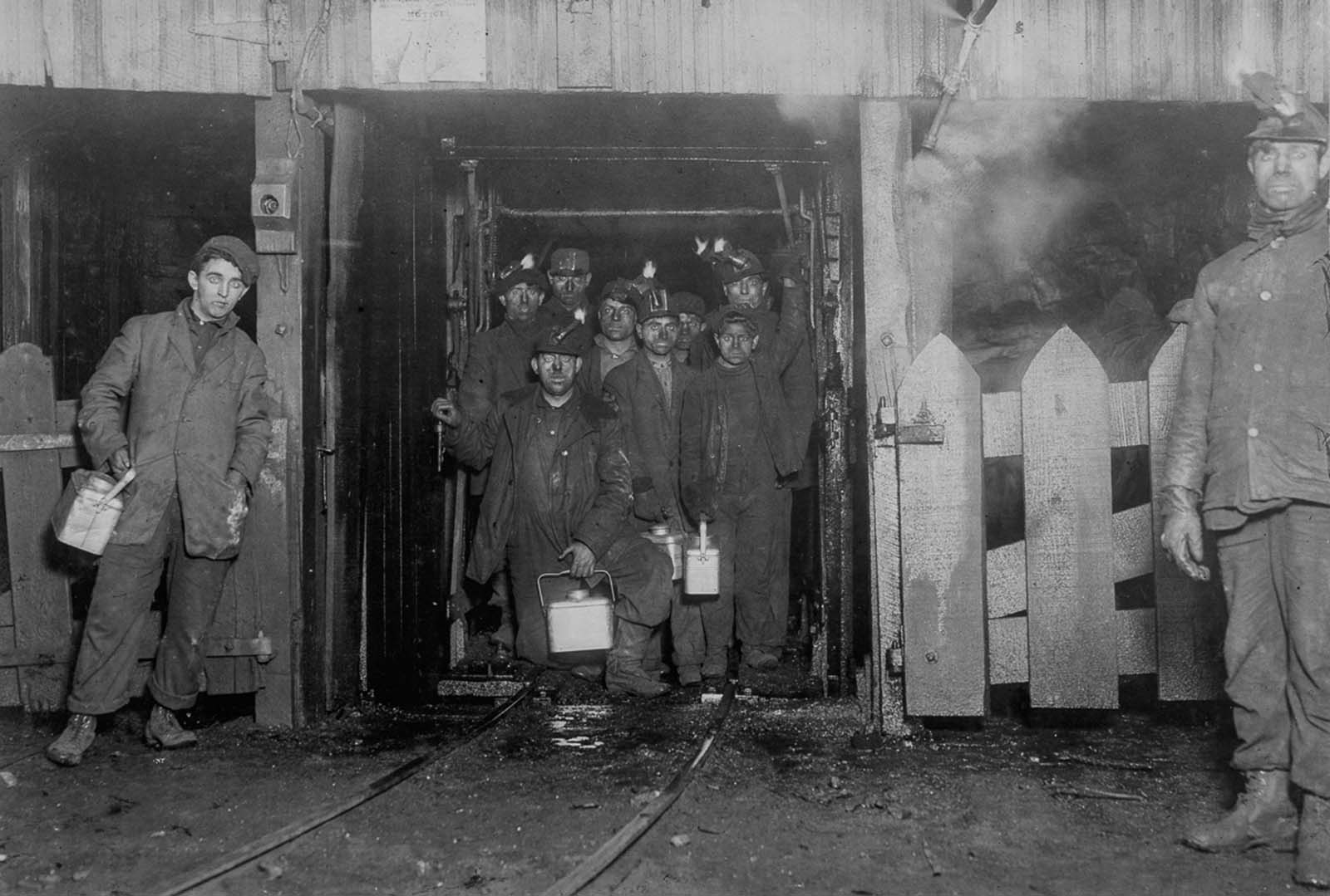 #27 Workers wait for the cage to ascend to the surface at the end of the day, 1910