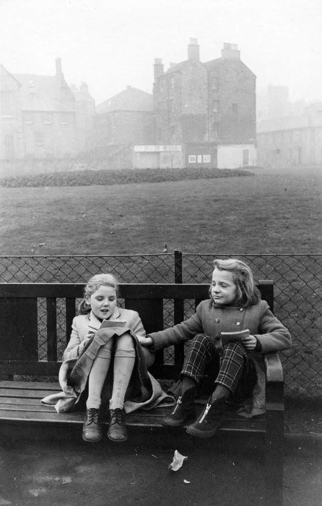 #43 Girls sitting on the bench in foggy evening, West Richmond Street, Edinburgh, 1960