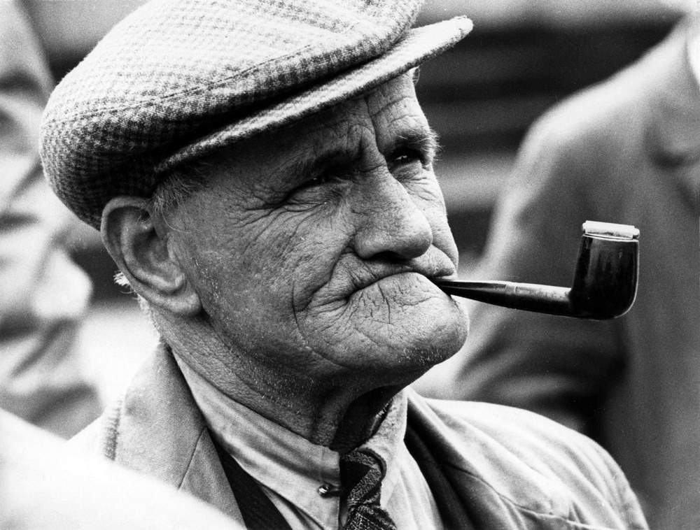 #12 A man listening among the crowd at the mound, Edinburgh, 1964
