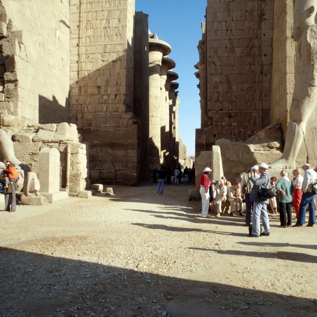 #49 Tourists visiting the remains of Luxor temple, Egypt 1980s.