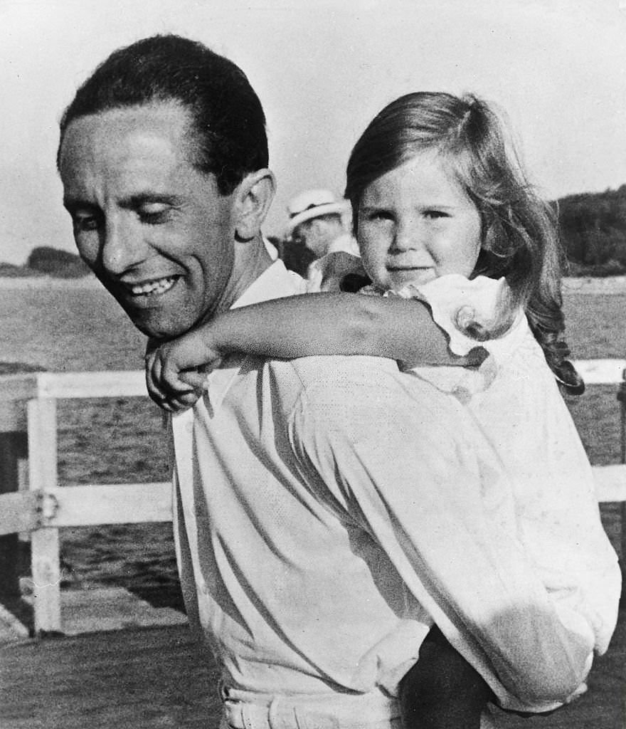 #23 Joseph Goebbels with his daughter Helga during a holiday on the pier of the Mecklenburg Baltic Sea resort of Heiligendamm, 1935