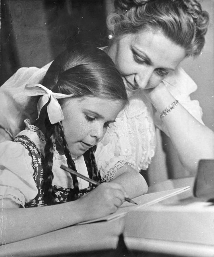 #25 Joseph Goebbels with their daughter Helga doing homework, 1939