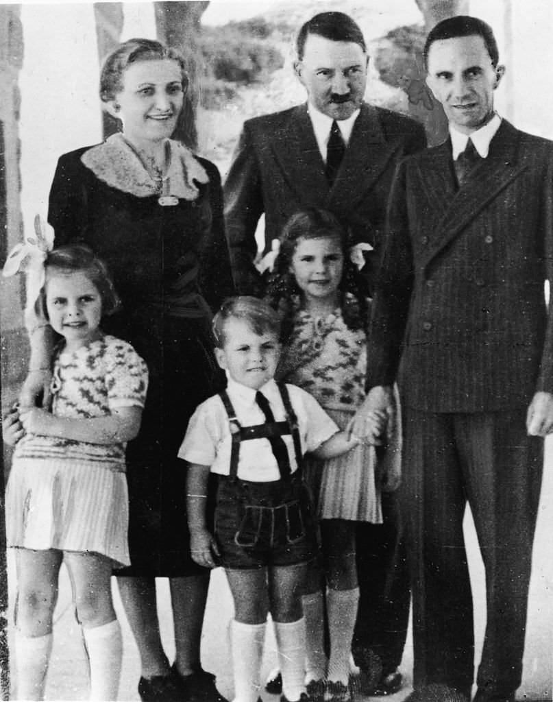 #46 Adolf Hitler with Joseph Goebbels and his wife Magda and their three oldest children, left to right, Hilda, Helmut, and Helga, 1930s