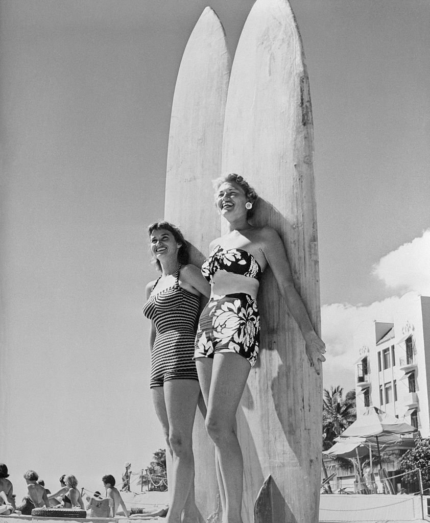 #129 Mary Ray Fearon and Oralee Kiewit Posing with Their Surfboards, 1955