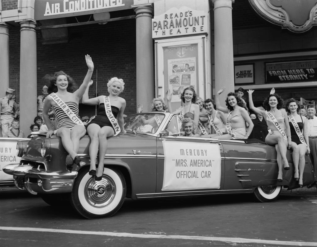 #131 Contestants in the Mrs America 1953 pageant pose on a Mercury ‘Mrs America’, 1953