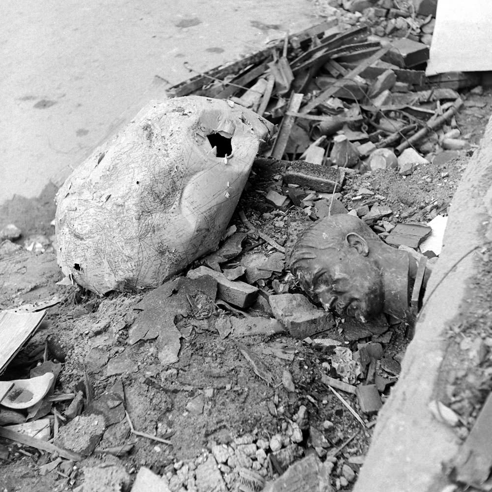 #19 An image almost too perfectly symbolic of Berlin in 1945: A crushed globe and a bust of Hitler amid rubble outside the ruined Reich Chancellery.