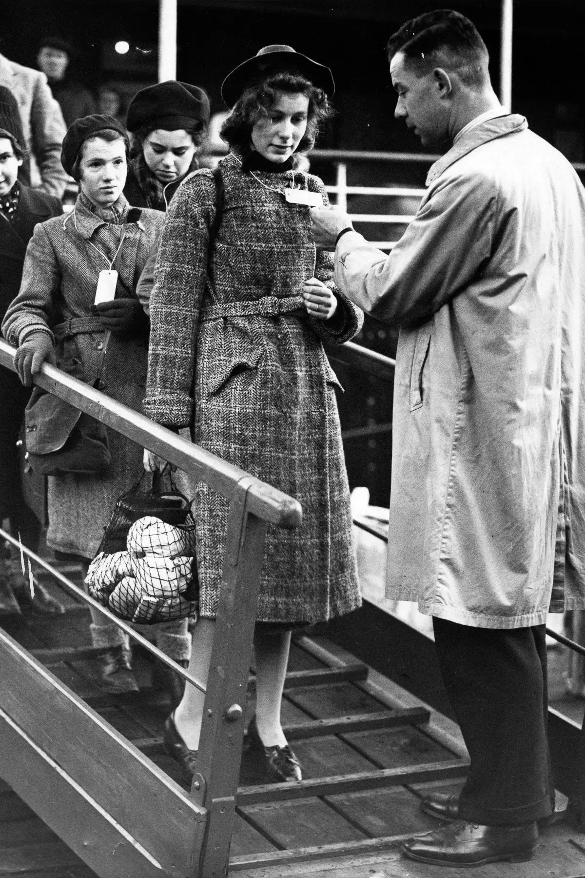 #5 A refugee is met by a Kindertransport agent, 1938.