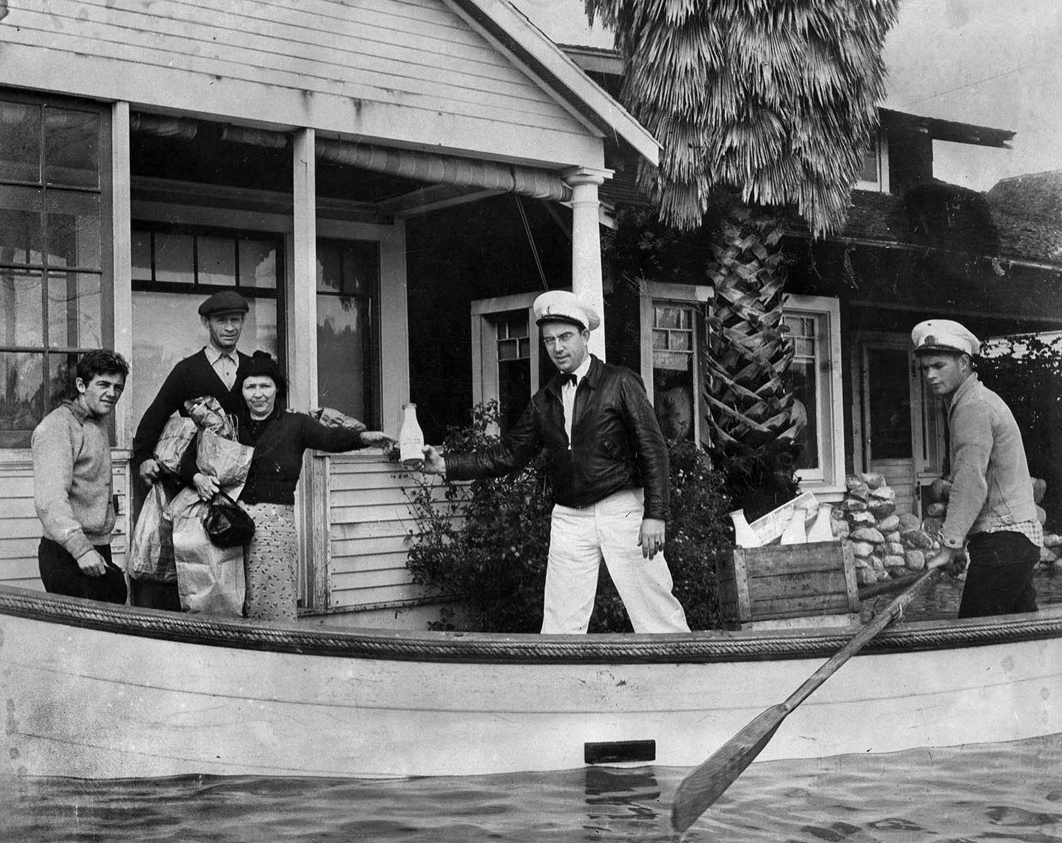 #74 Milkman Ray J. Henville secured himself a boat and boatman and made all deliveries on time and on doorstep, 1938
