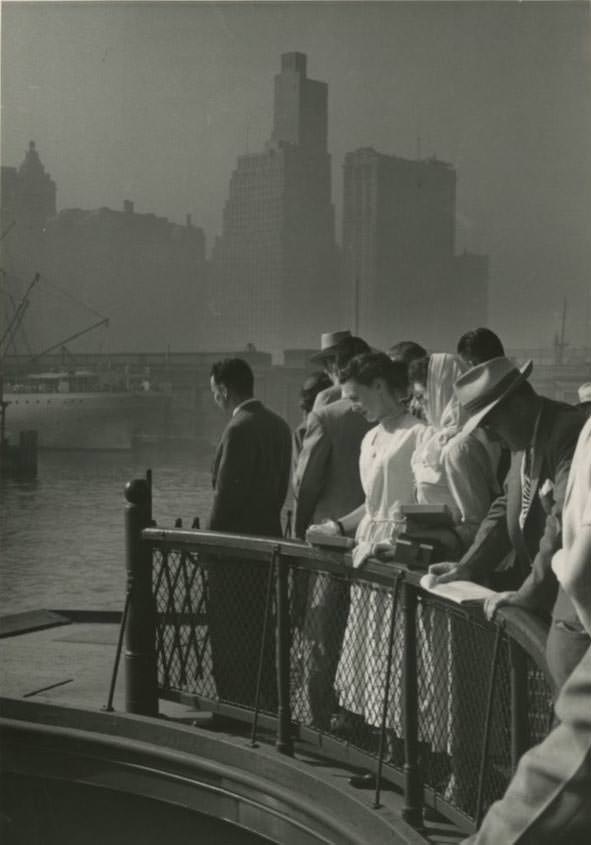 #7 Passengers on the upper deck of a Central Railroad of New Jersey ferry in Jersey City going to Liberty Street in Manhattan, 1950