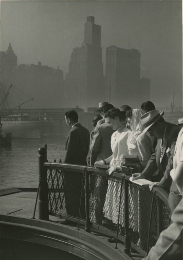 #36 Passengers on the upper deck of a Central Railroad of New Jersey ferry in Jersey City going to Liberty Street in Manhattan, 1950