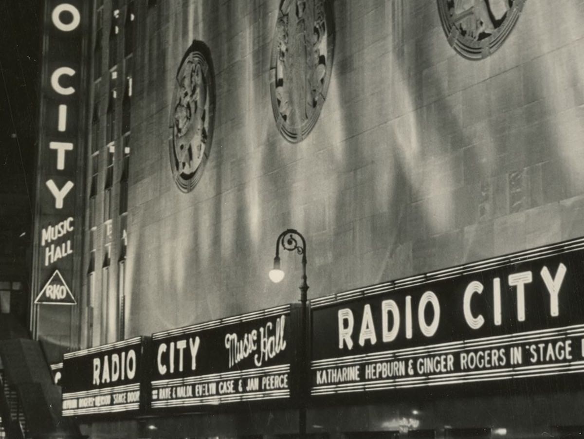 #2 Radio City Music Hall at night. 6th Avenue El station at left. (about 1939)