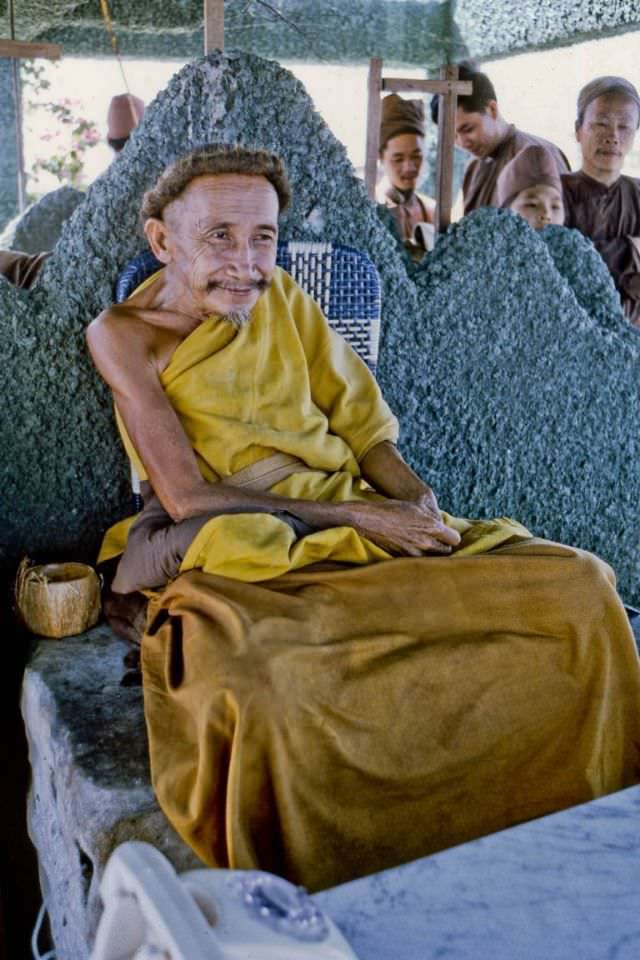 #15 Vietnam’s Coconut Monk in his tower at the east end of his “floating” platform refuge
