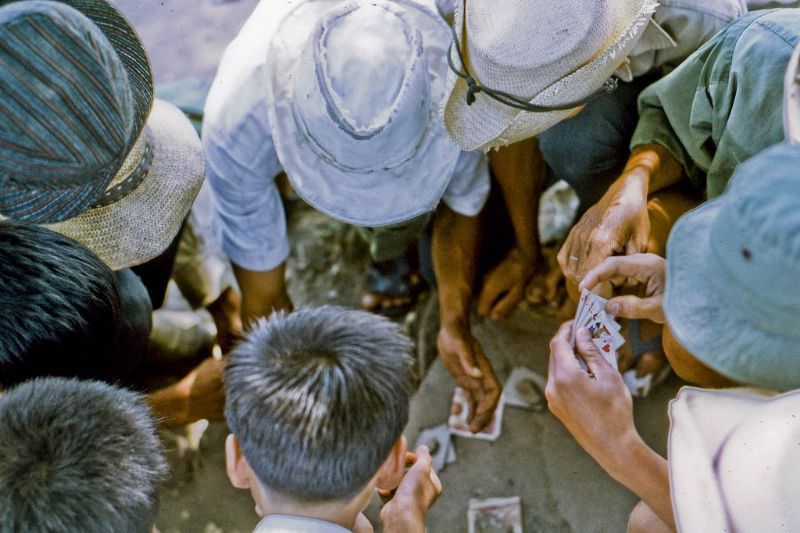 #22 Local men take a mid-day break for a little card game