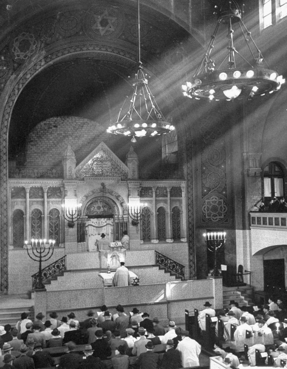 #13 Germans Jews praying in their synagogue during Passover.