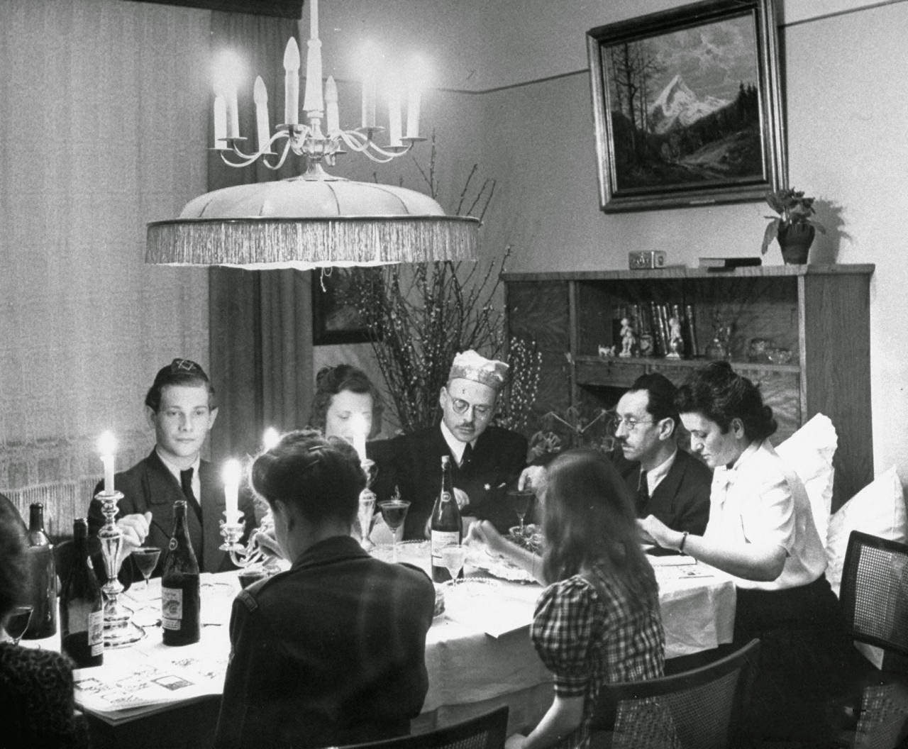 #4 A family and their guests having Passover Eve seder.