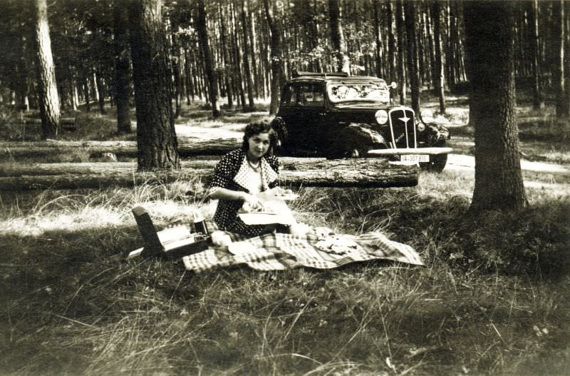 #10 A young lady in a polka dot dress enjoying a picnic in the woods, 1938