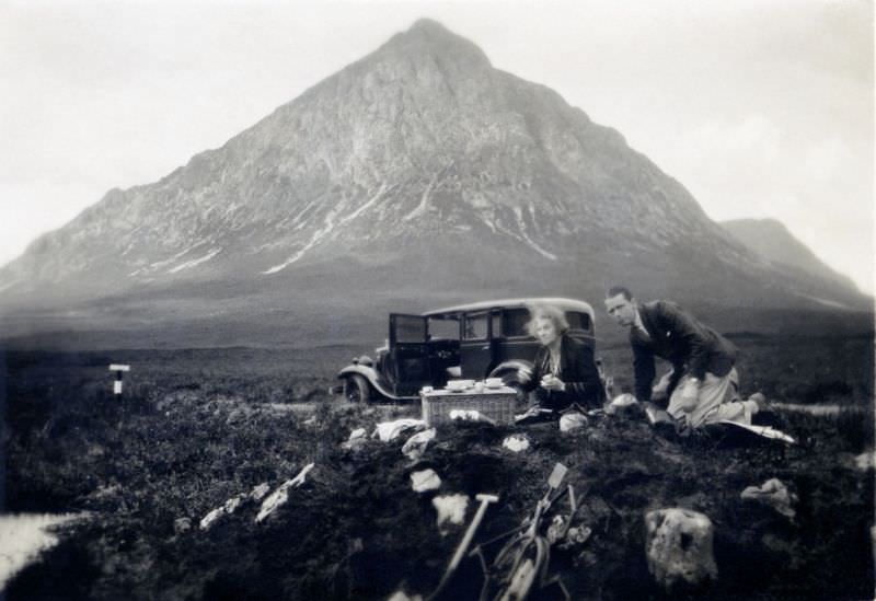 #2 A stylish couple enjoying a picnic on a windy day in the Scottish Highlands near Buachaille Etive Mòr mountain, 1932