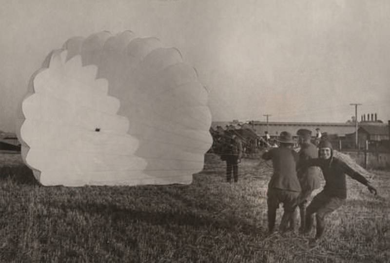 #89 Parachutist landing, 1920s