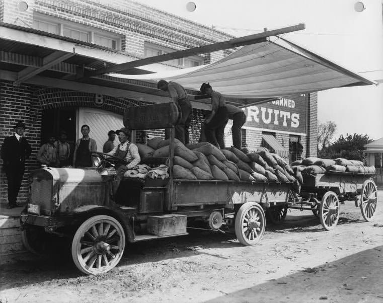 #107 Transporting fruit for canning by open truck, 1925