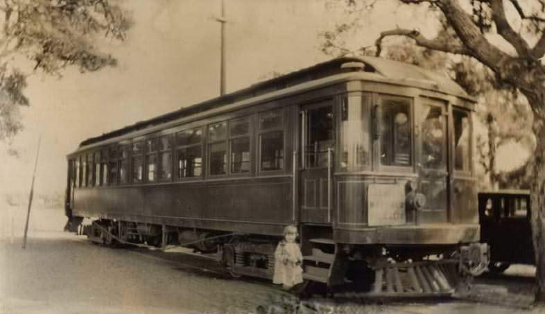 #127 Alice Smothers in front of trolley car, 1920