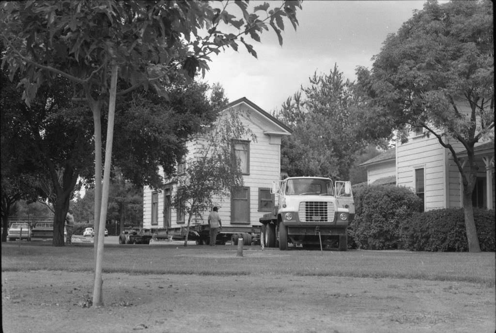#105 Zanker House in the moving truck as it makes its way into History Park, 1986