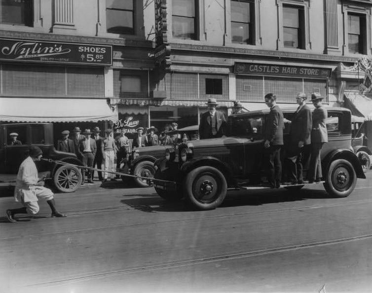 #24 Woman pulling car with teeth, San Jose, California, 1926