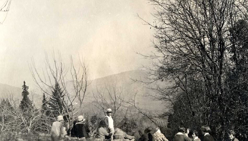 #42 Pathfinders sitting on hillside overlooking valley, 1920s