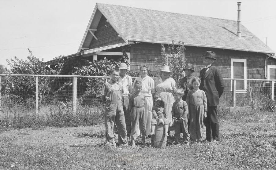 #70 A family standing in front of a building, 1921