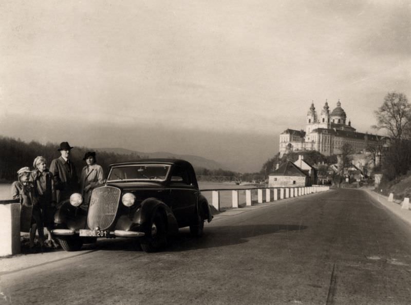 A family pose with a Steyr 220 Gläser Cabriolet on a sunny winter’s day, 1939