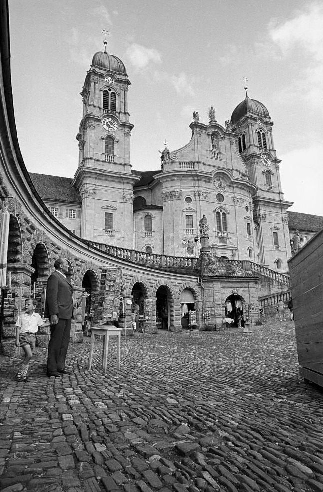 #123 Father and son in front of souvenir shops in Einsiedeln, 1970