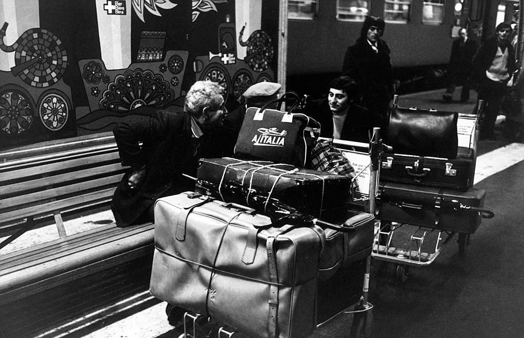 #59 Seasonal Italian emigrants waiting at the train station to go back home. Switzerland, 1970s