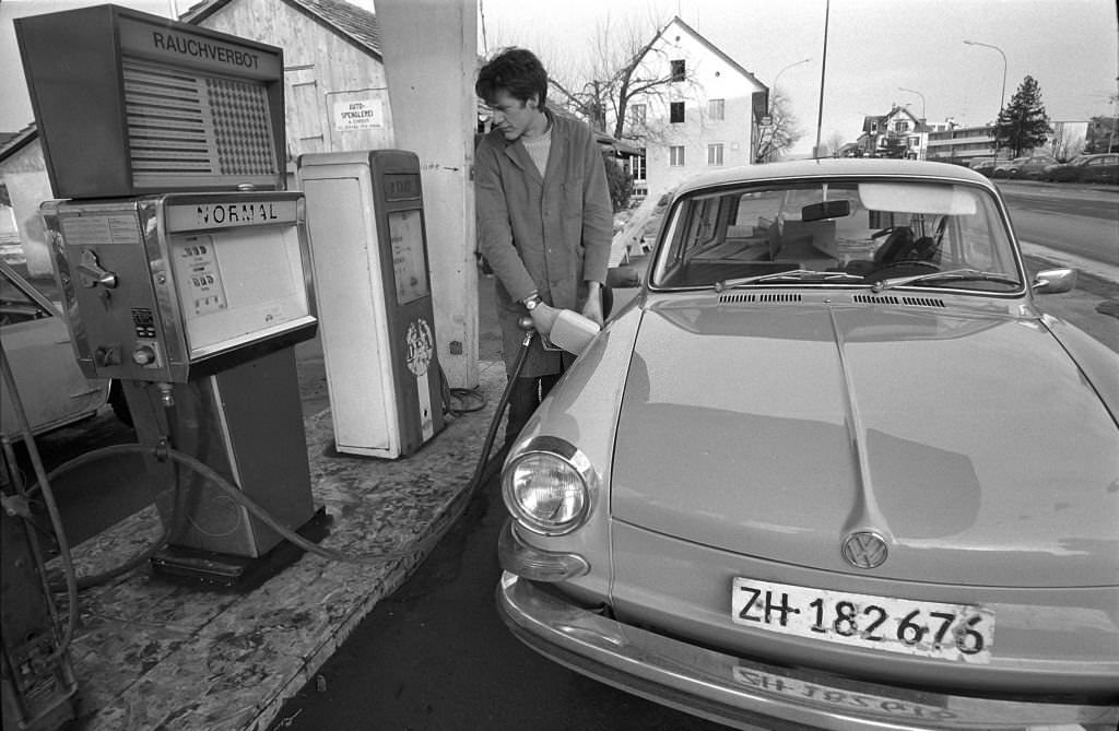 #93 Zurich; filling station attendant at gasoline pump, 1970