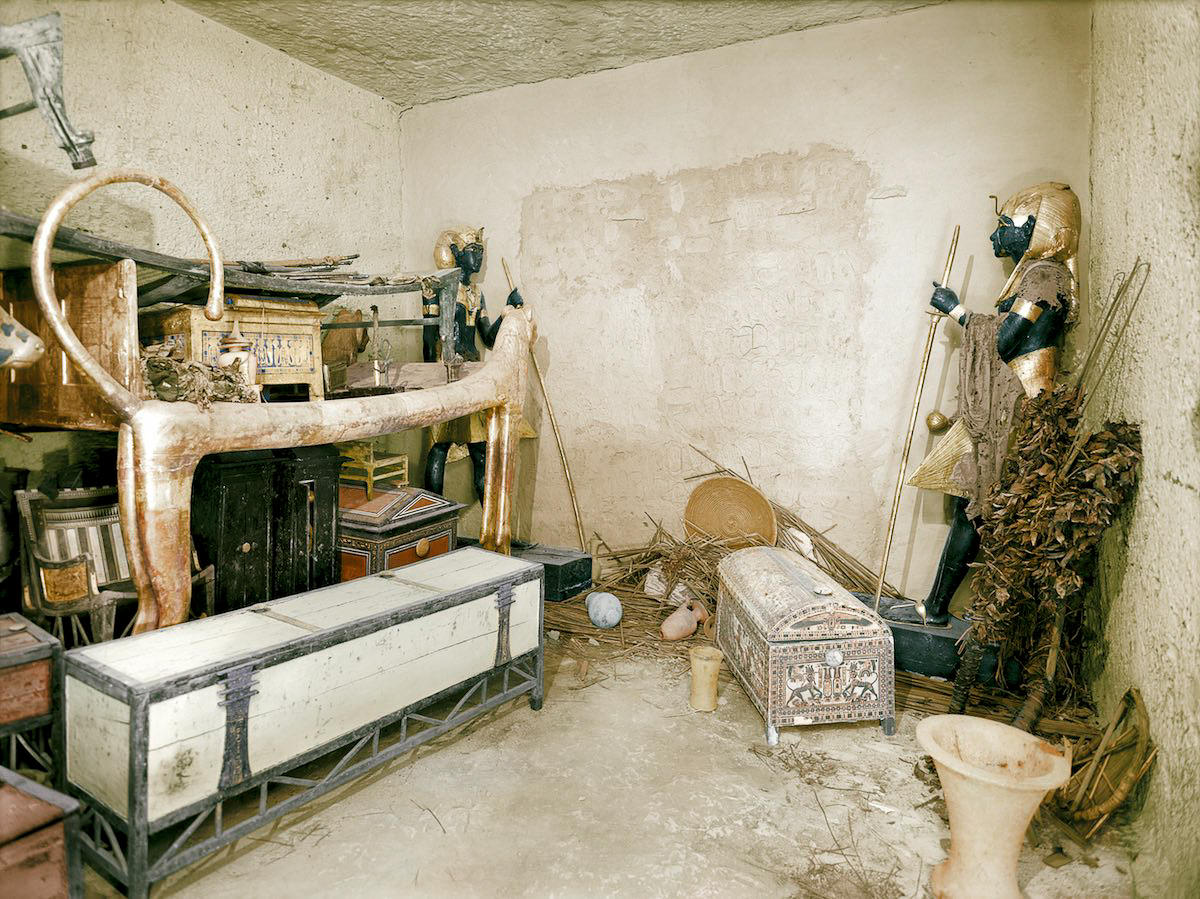 View of the northern wall of the Antechamber showing the sentinel statues (Carter nos. 22 &; 29) guarding the sealed doorway leading to the King’s Burial Chamber. Tutankhamun’s Tomb, December 1925