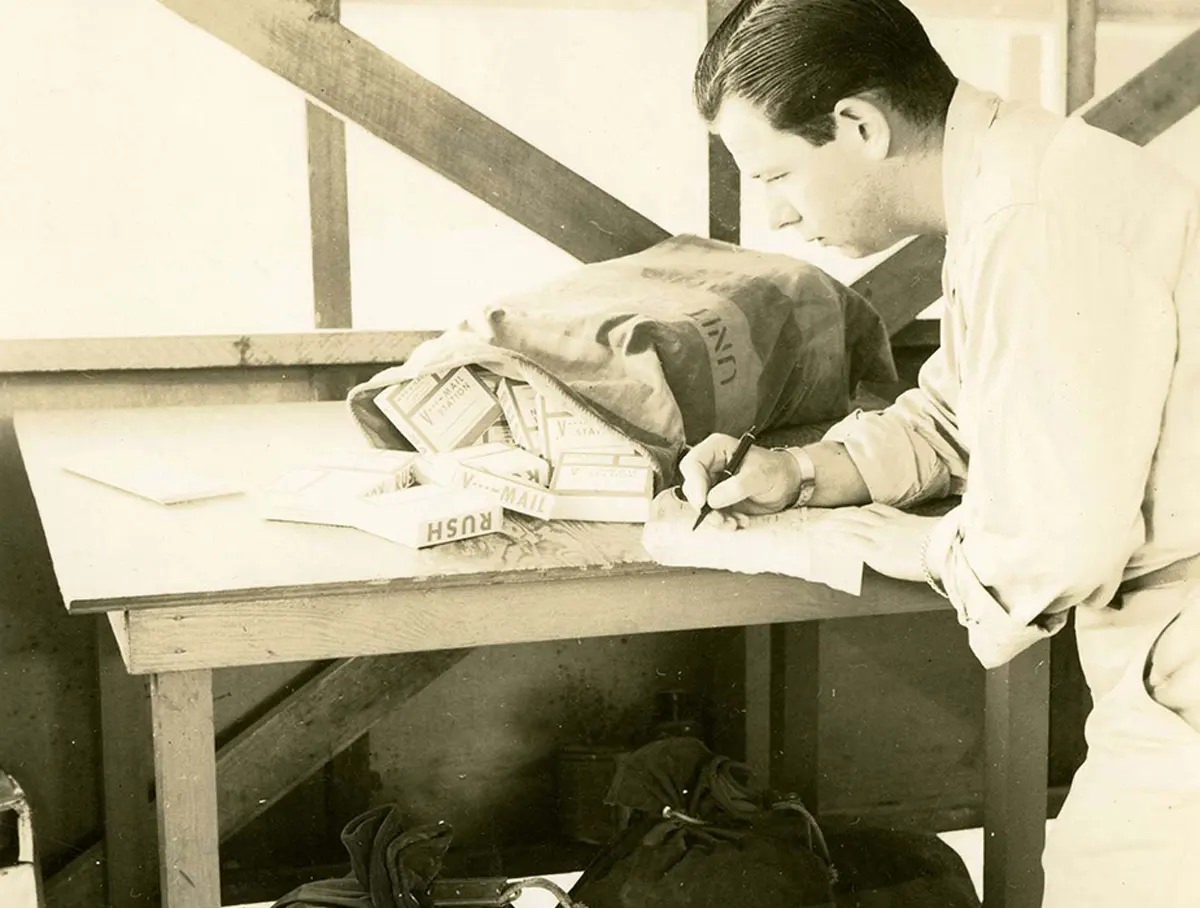 #19 Initial step in the Receiving section is this operation of checking the postal dispatch sheets and logging in the rolls received from the States.