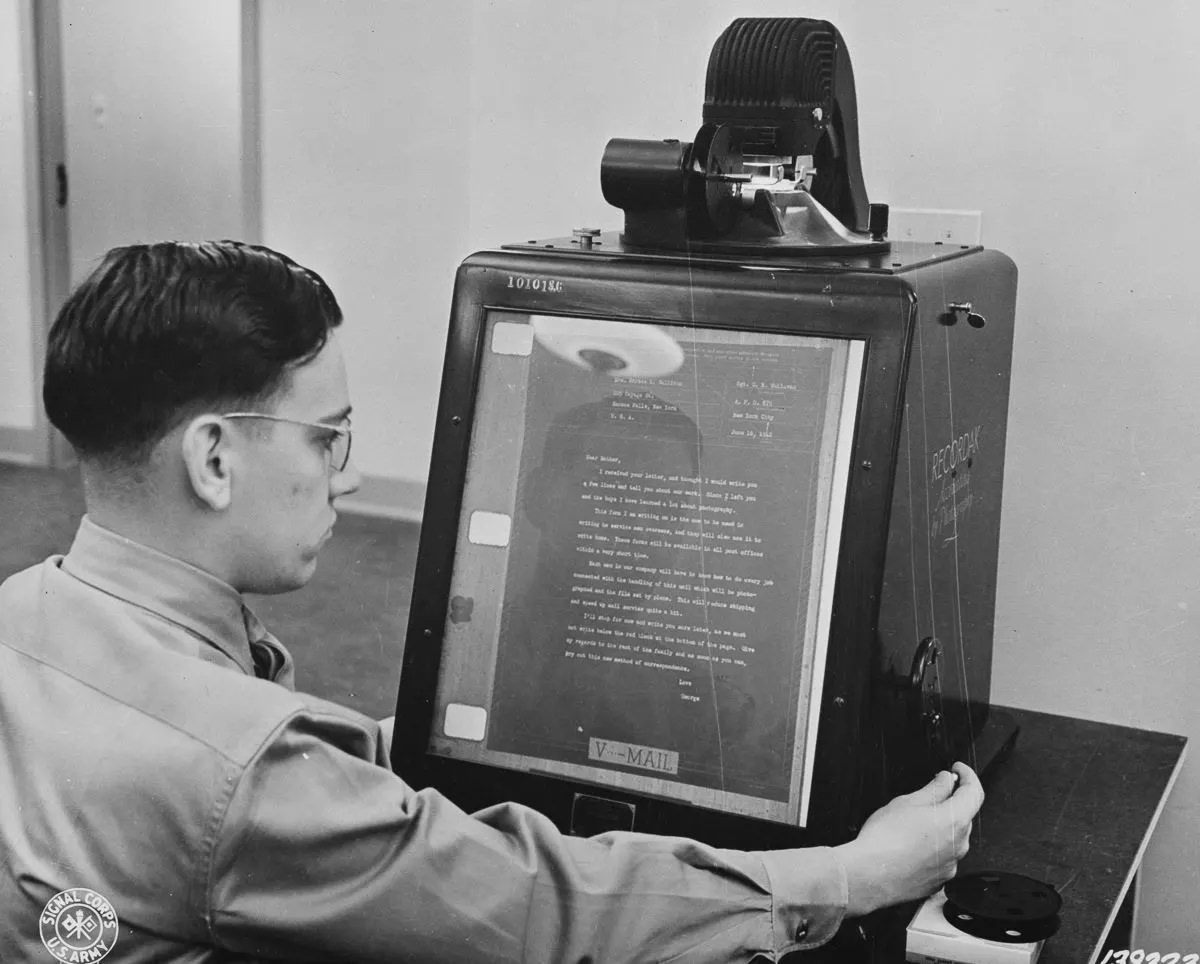 #3 V-mail is inspected for flaws on an enlarging reader.