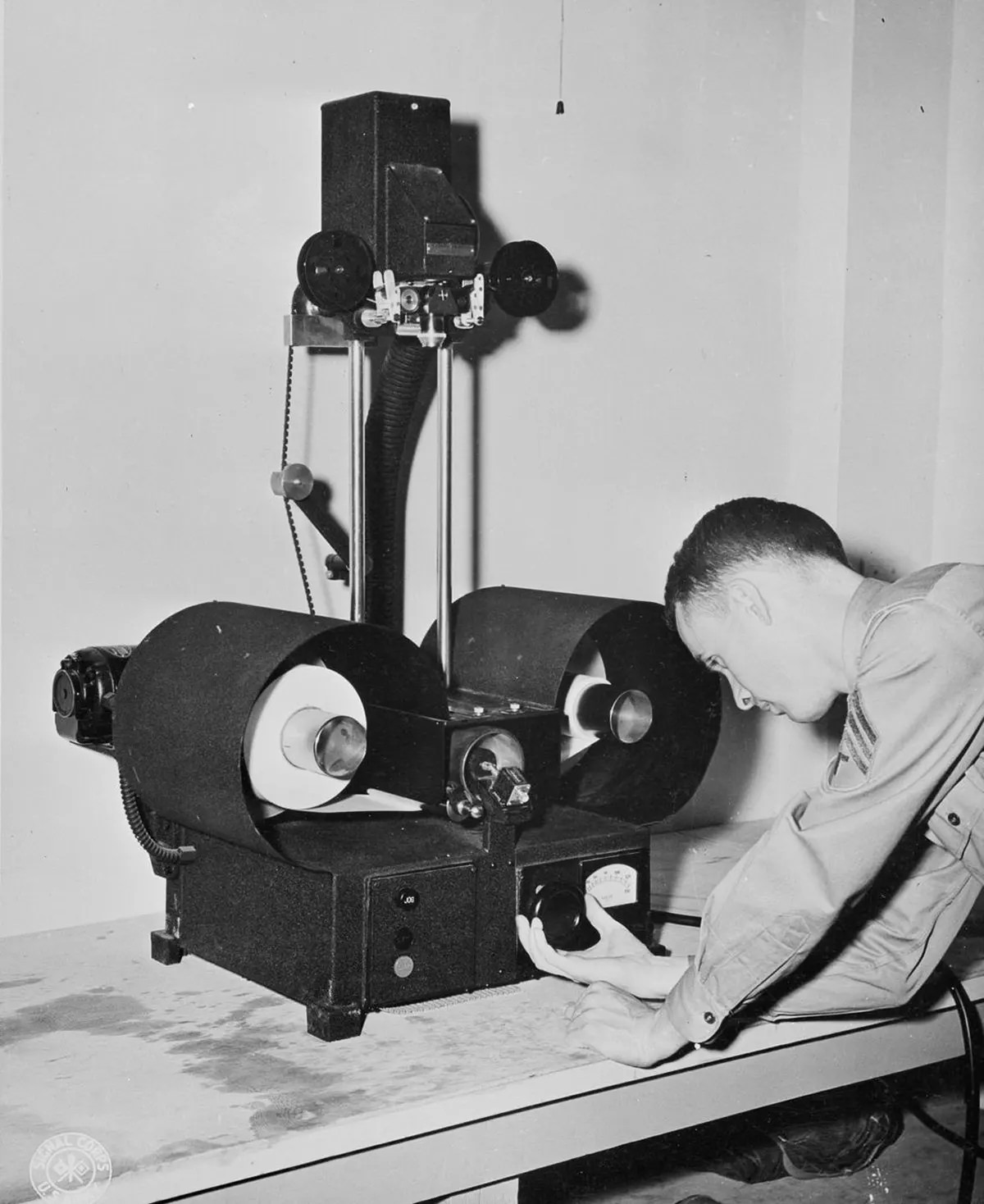 #4 V-mail letters are printed onto paper using a continuous enlarger.