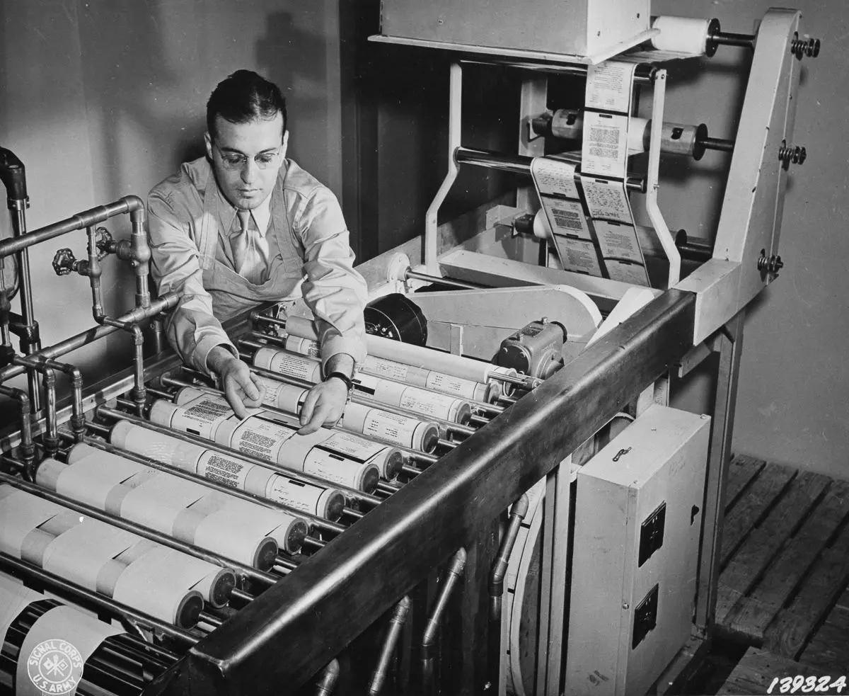 #5 Paper reproductions from V-mail microfilm are developed, fixed, washed and dried on a continuous paper processing machine.
