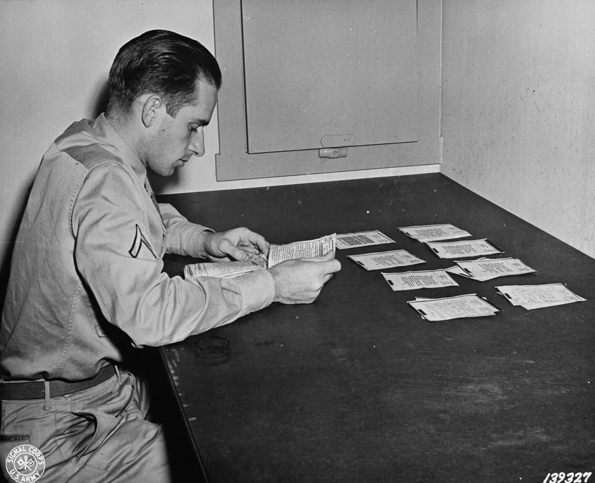 #11 Finished V-mail letters are sorted and prepared for forwarding to recipients.