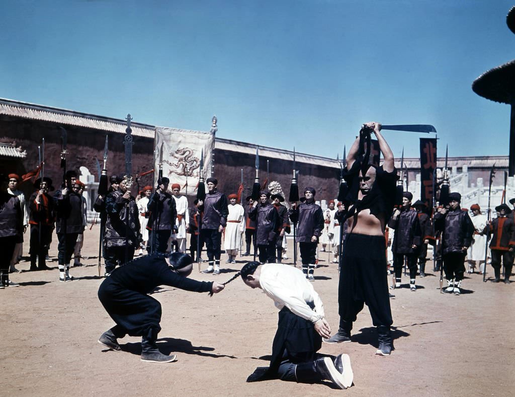 A man is killed in a scene from the film ’55 Days At Peking’, 1963.