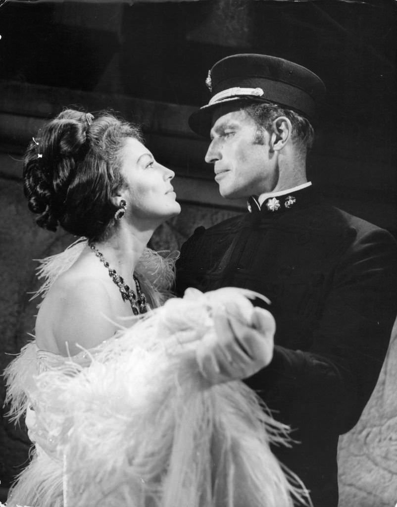 Ava Gardner dances with Charlton Heston in a scene from the film ’55 Days At Peking’, 1963.