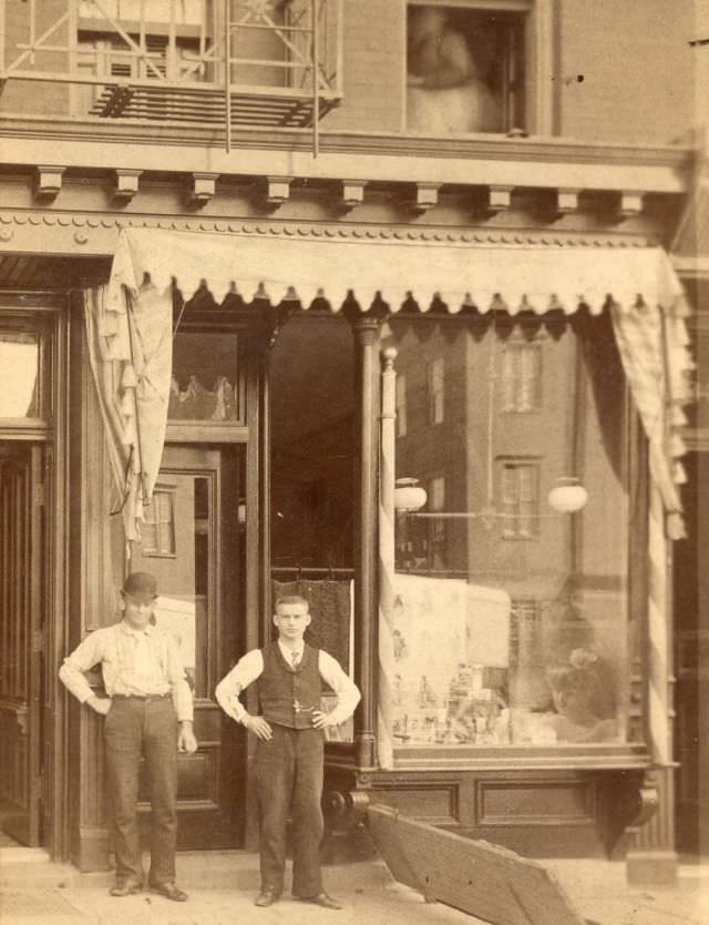 #17 Two men outside storefront, 2336 Broadway, New York, 1880s