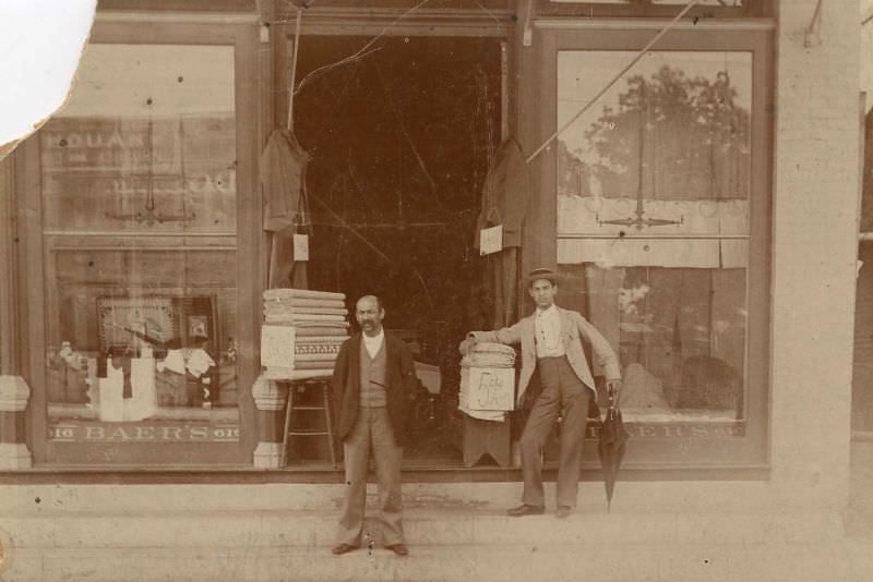 #28 Two men outside haberdashery, 1890s
