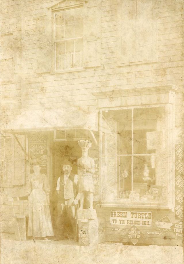 #8 Man and woman outside tobacconist shop, 1880s