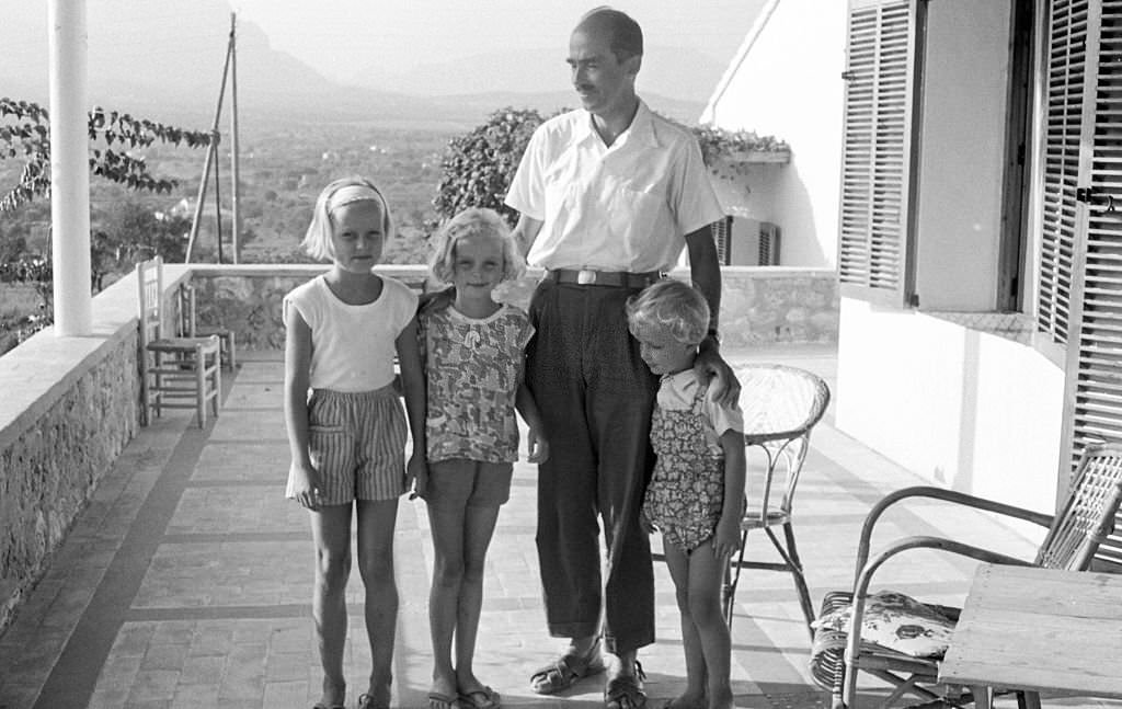 #3 Grand Duke Otto von Habsburg as he poses with three of his daughters during a holiday, Benidorm, Alicante, Spain, 1963.
