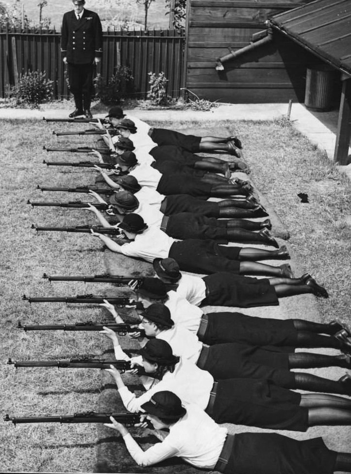 #61 Members of the Women’s Royal Naval Service, nicknamed Wrens, train in marksmanship at a rifle range during WWII.