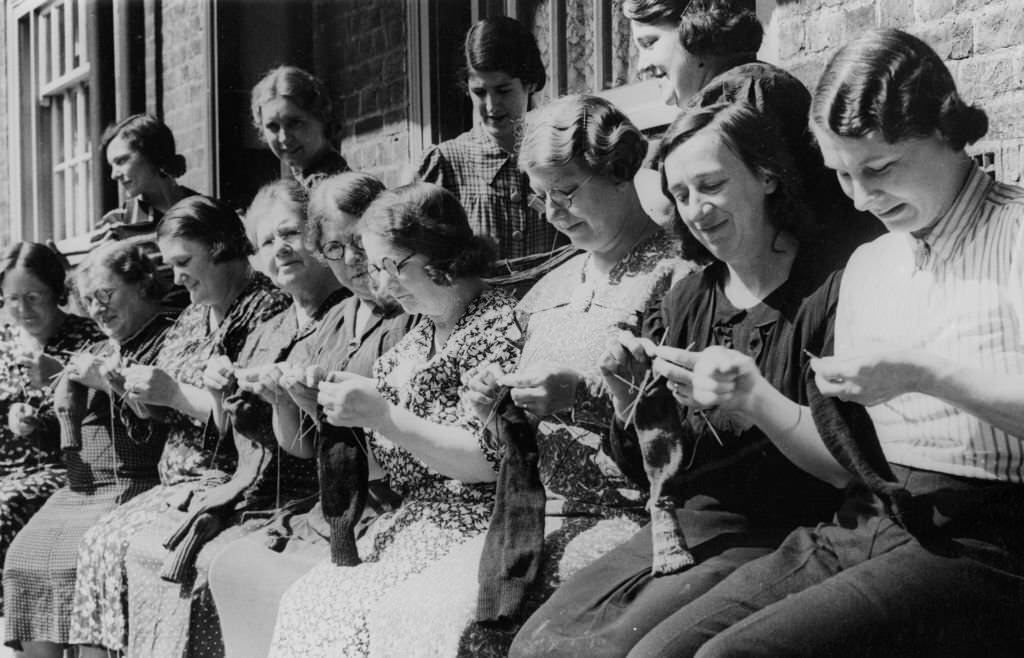 #75 Women from the Duchy of Cornwall Estate in South London knit socks with wool bought from the proceeds of their children’s salvage efforts.