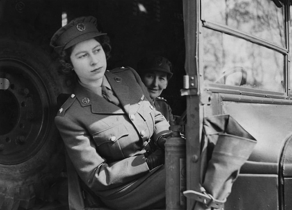 #84 Princess Elizabeth (now Queen Elizabeth II) driving an ambulance during her wartime service in the A.T.S. (Auxiliary Territorial Service), 10th April 1945.