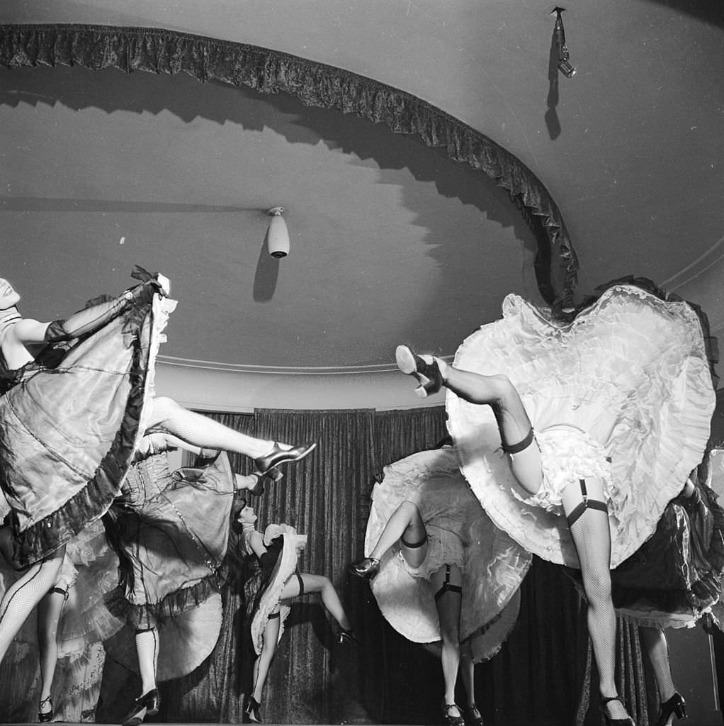 #50 A cabaret dancer performs at London’s Pigalle nightclub in Piccadilly, 1955.